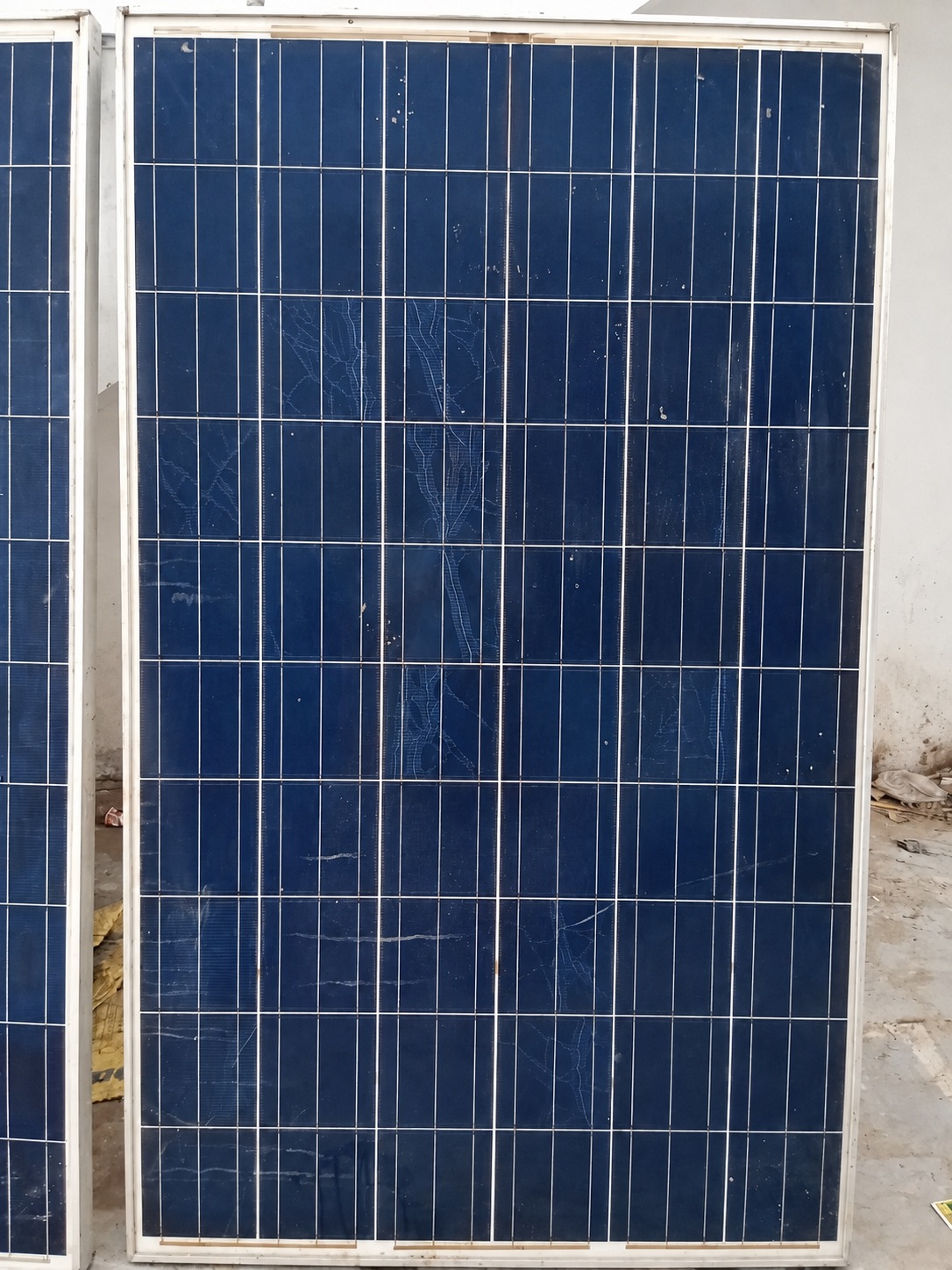 Solar module with visible cracks across its glass
